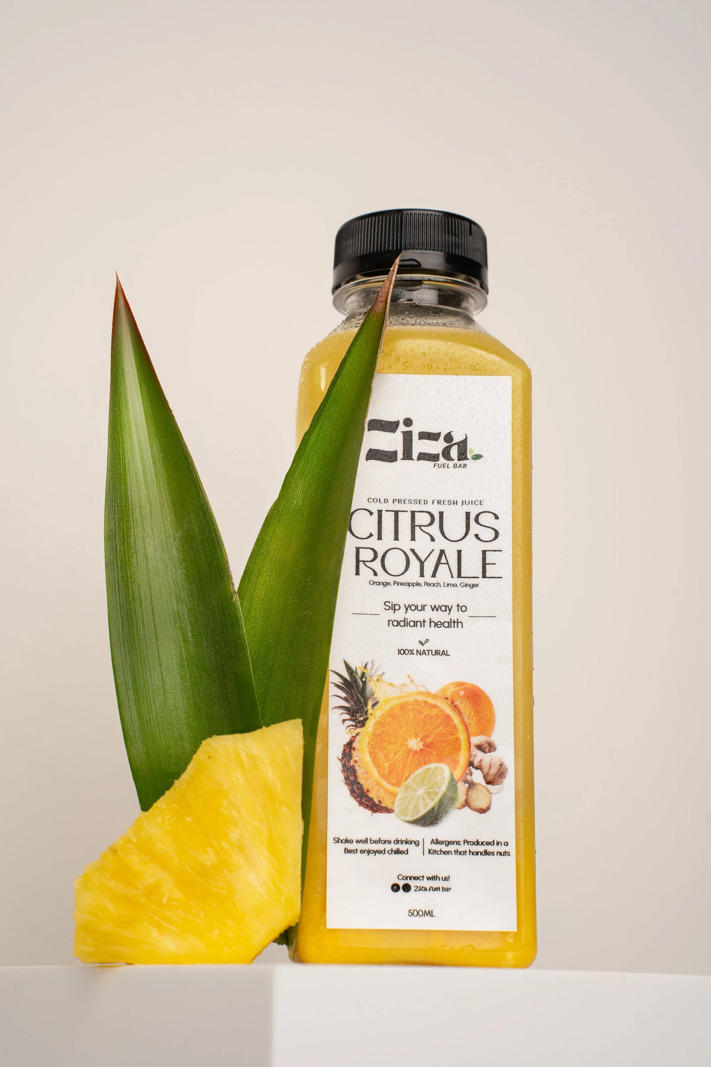 Fresh natural  cold pressed Citrus royale juice from Ziza Fuel Bar UK lifestyle shoot