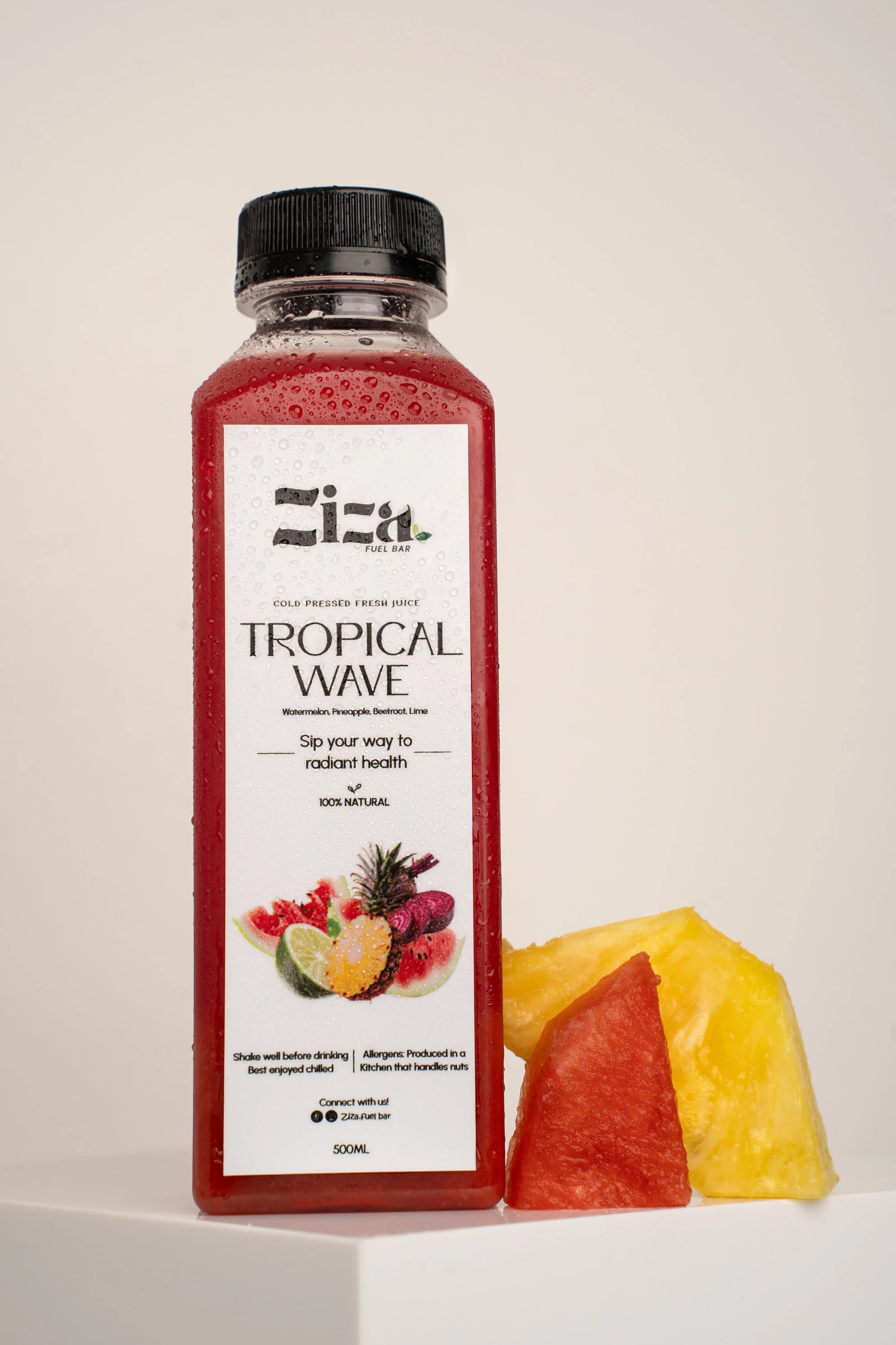 Bottle of Ziza fuel bar  Tropical Wave cold pressed juice with fruit illustration on a white background