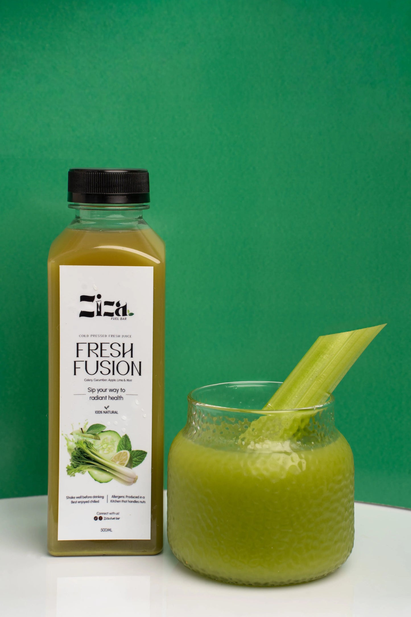 fresh fusion cold pressed juice made from celery, cucumber, apple, lime, and mint - ziza fuel bar.  lifestyle shoot