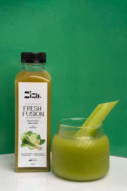 fresh fusion cold pressed juice made from celery, cucumber, apple, lime, and mint - ziza fuel bar.  lifestyle shoot