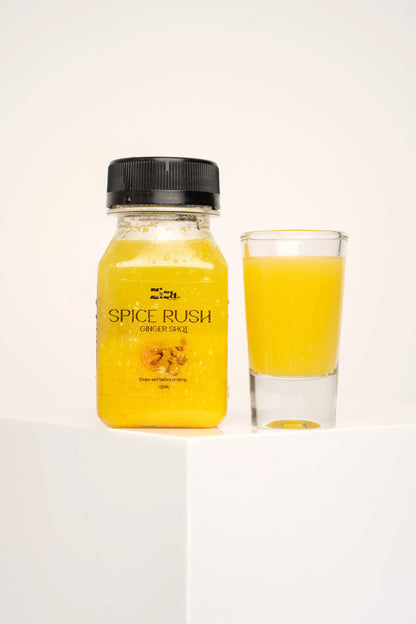 Fresh spice rush ginger shot cold pressed juice drink bottle, from Ziza Fuel Bar UK lifestyle shoot